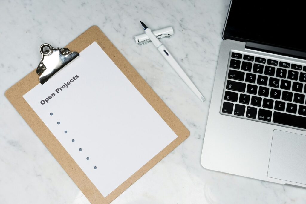 Team drafting an RFP checklist on a notebook